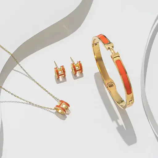[23.688697499999996] Luxus Buchstaben Text Zahlen Titan Stahl 18K vergoldet 3-teiliges Set orange